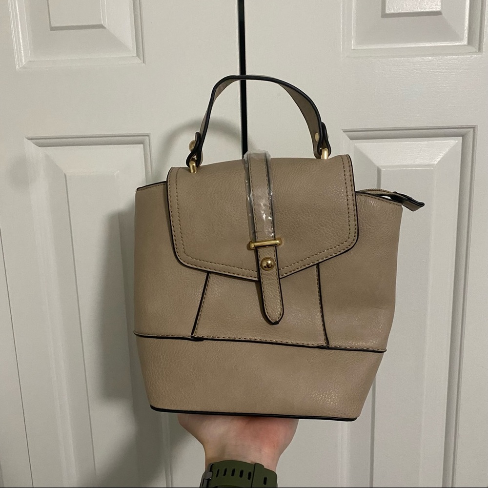 Tan leather fashion small purse; never used, strap attachments, inside pockets